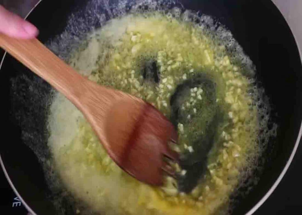 Sauteing the garlic to the butter for the garlic butter potatoes recipe