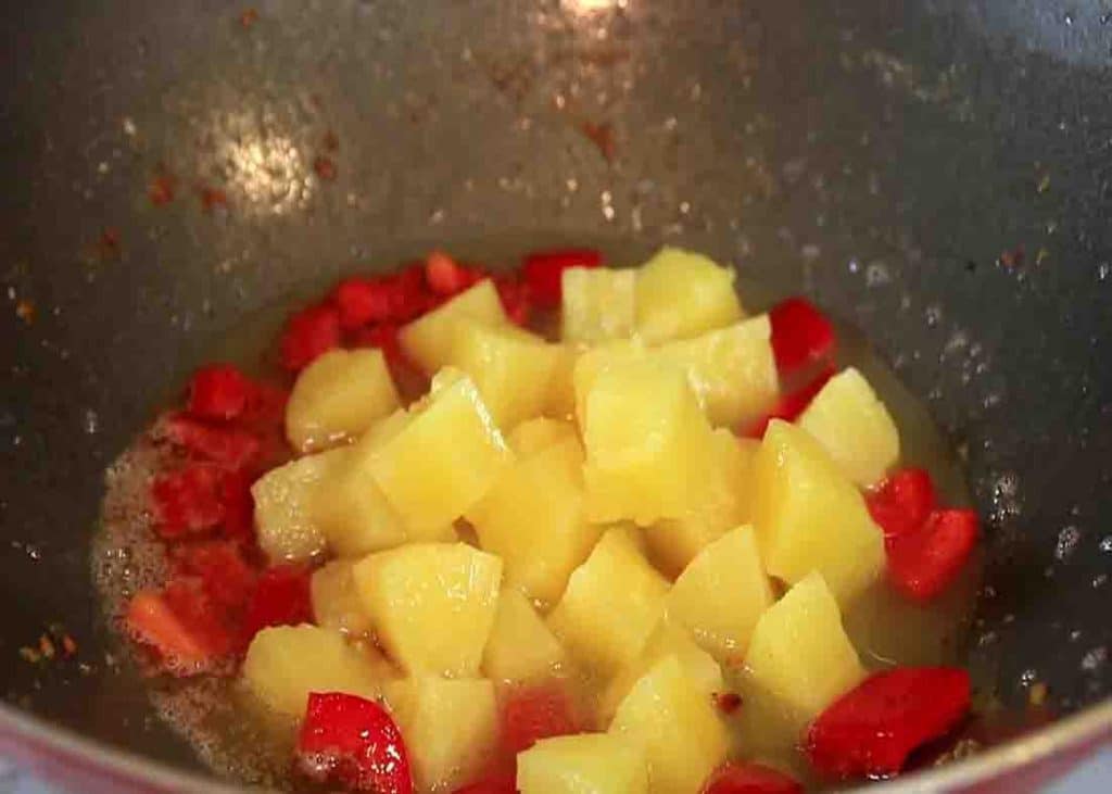 Making the pineapple sauce for the crispy pineapple chicken recipe