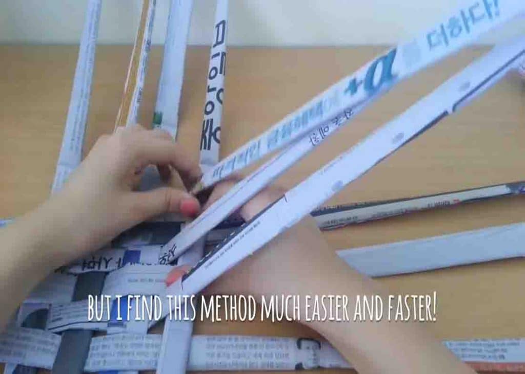 Weaving the base of the newspaper basket
