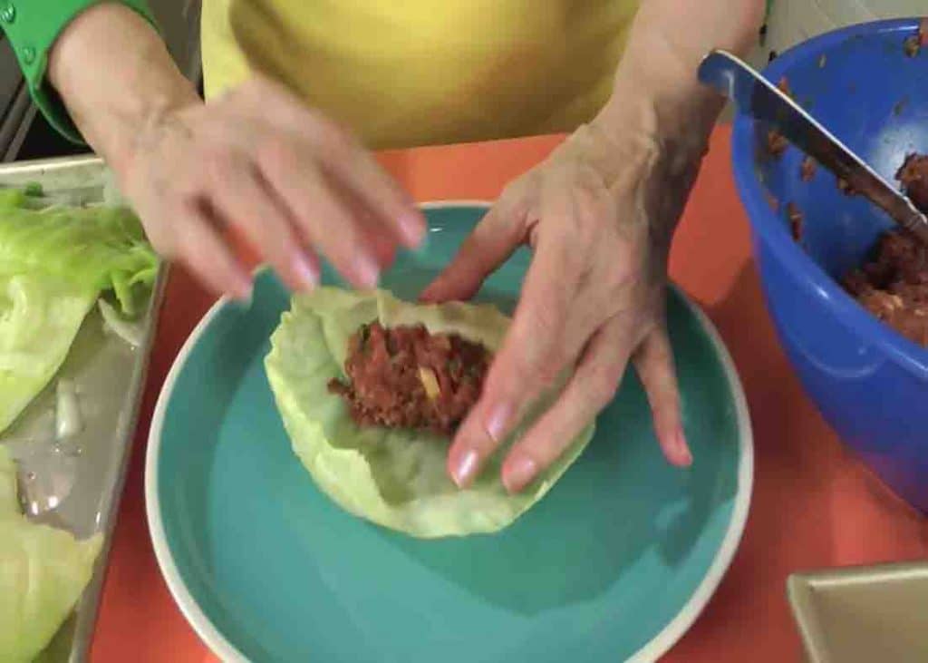 Rolling the cabbage leaf with its filling