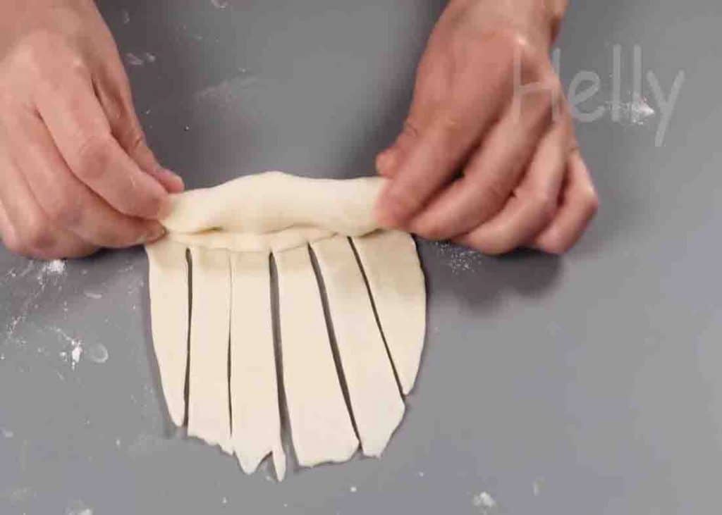 Rolling the dough to make the cheese bun