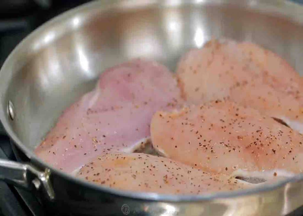 Sauteeing the chicken breasts for the Mexican chicken casserole recipe