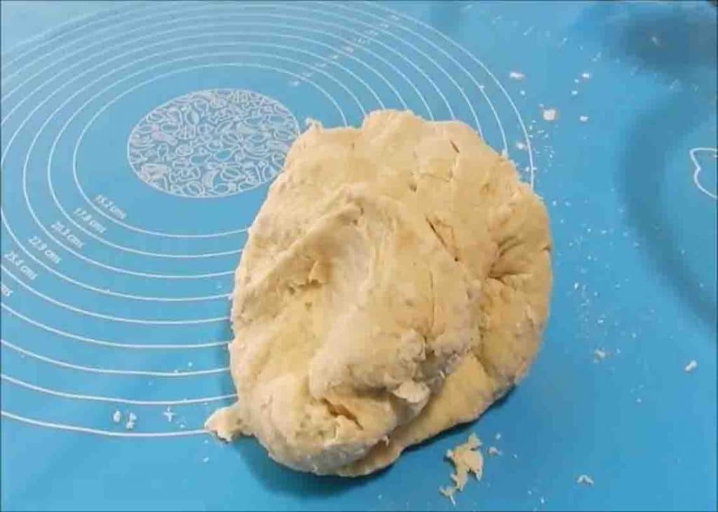 Kneading the pizza ball dough