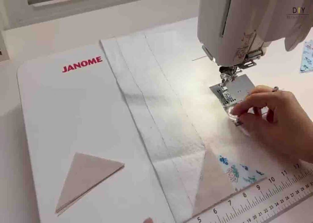 Sewing the large and small triangles to the flying geese placemat