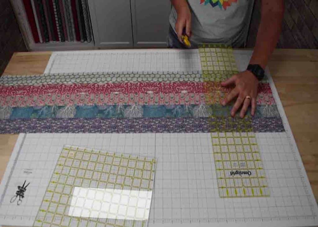 Cutting the blocks down to make the jelly-filled quilt