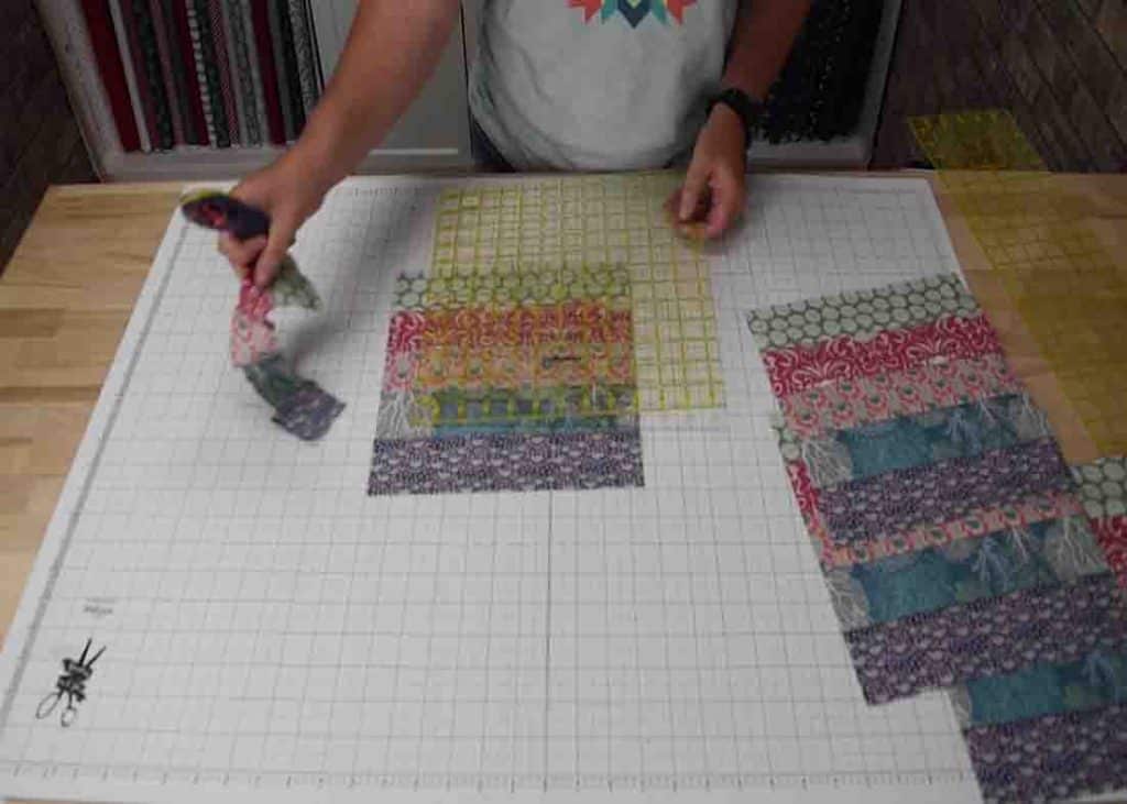 Measuring the blocks for the jelly-filled quilt project