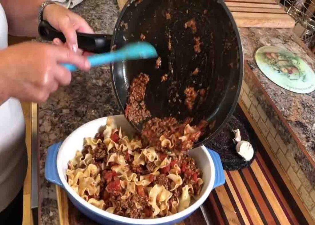 Adding the ground beef mixture in the casserole dish