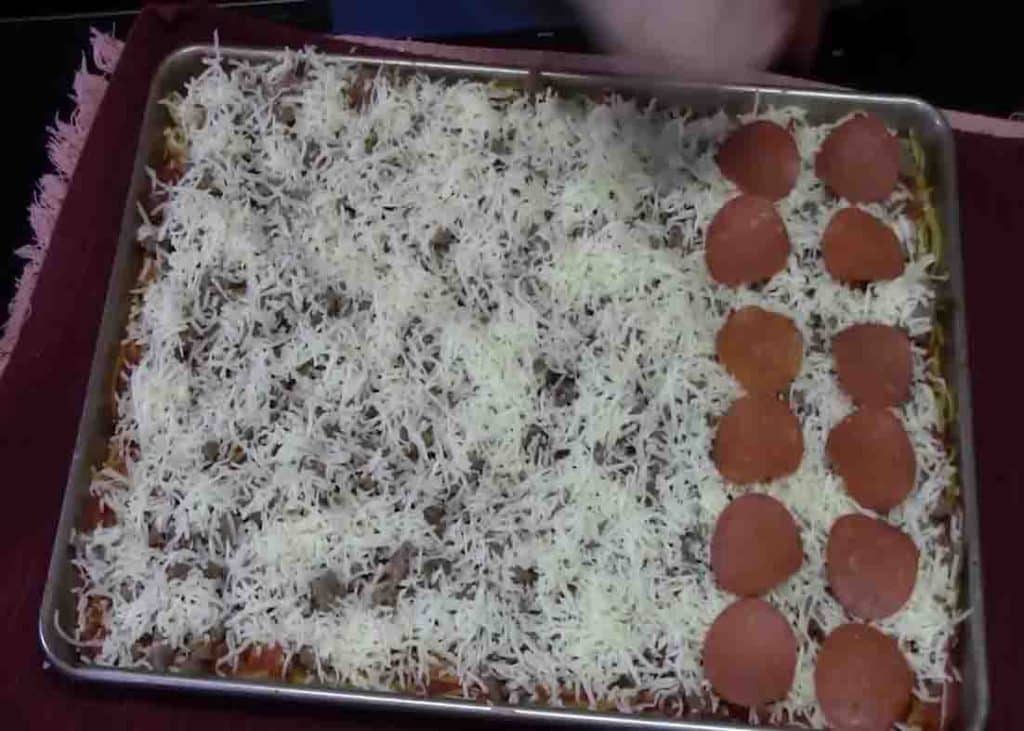 Layering the spaghetti pizza casserole