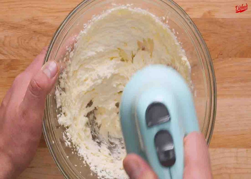 Blending the ingredients to make the sugar cookies