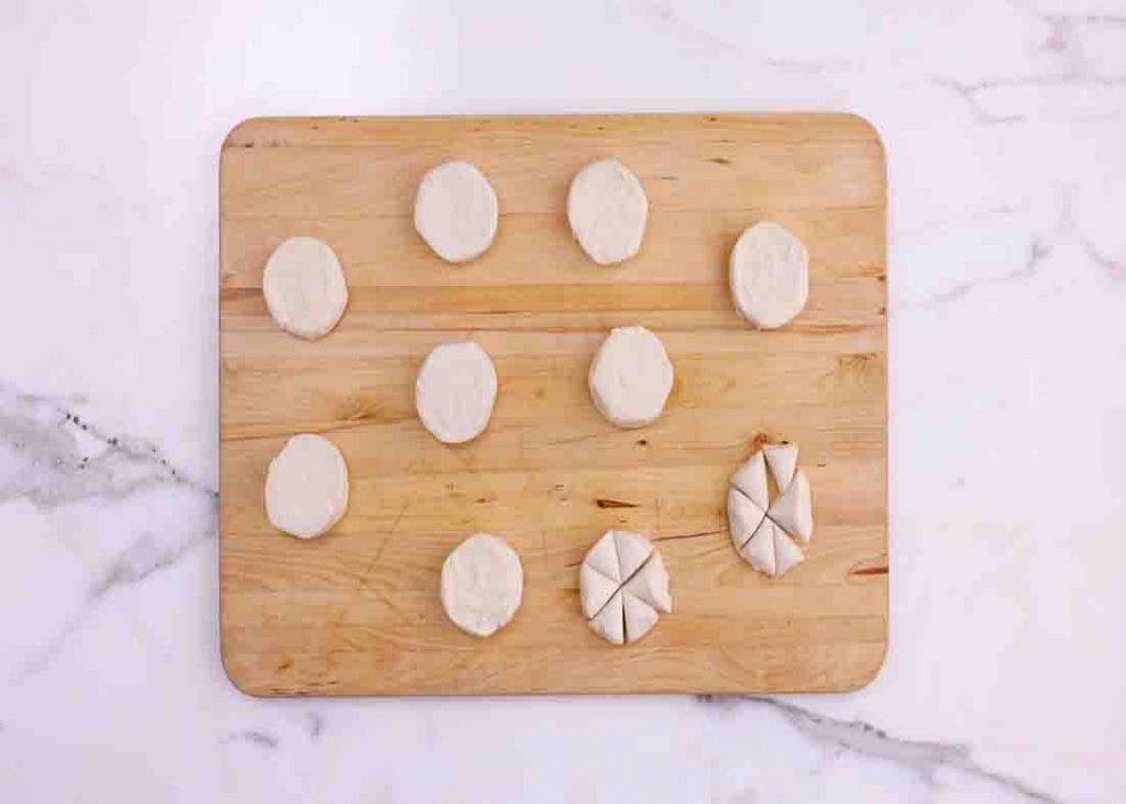 Slicing the biscuit dough to make mini monkey bread