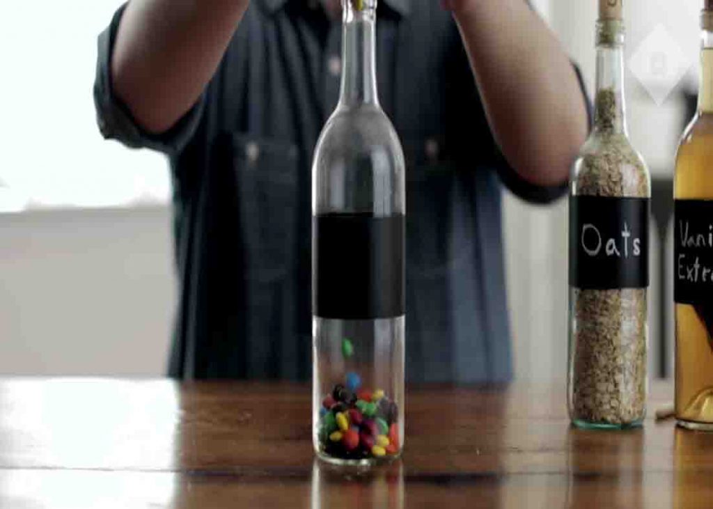 Repurpose your wine bottles by filling them with oats or goodies