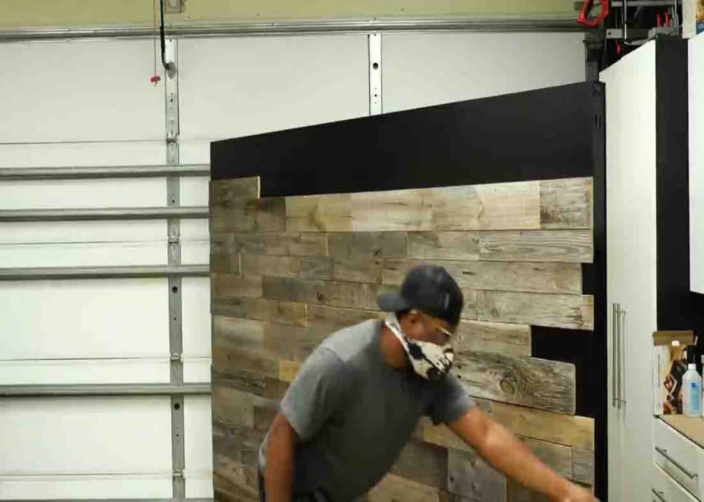 Placing the pallets to create the portable wall