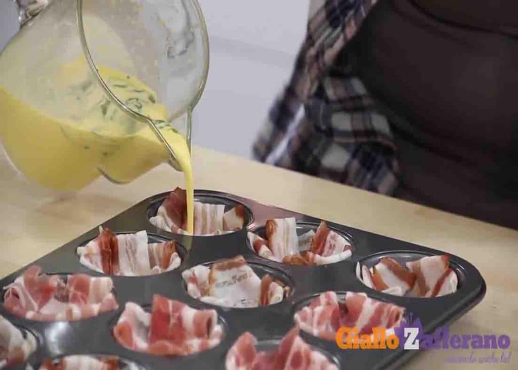 Pouring the egg mixture to the bacon baskets