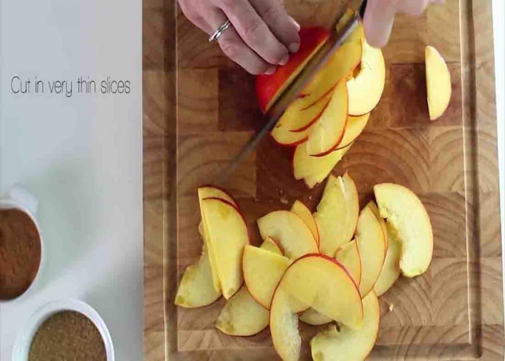 Slicing the nectarines into thin slices for the nectarine roses recipe