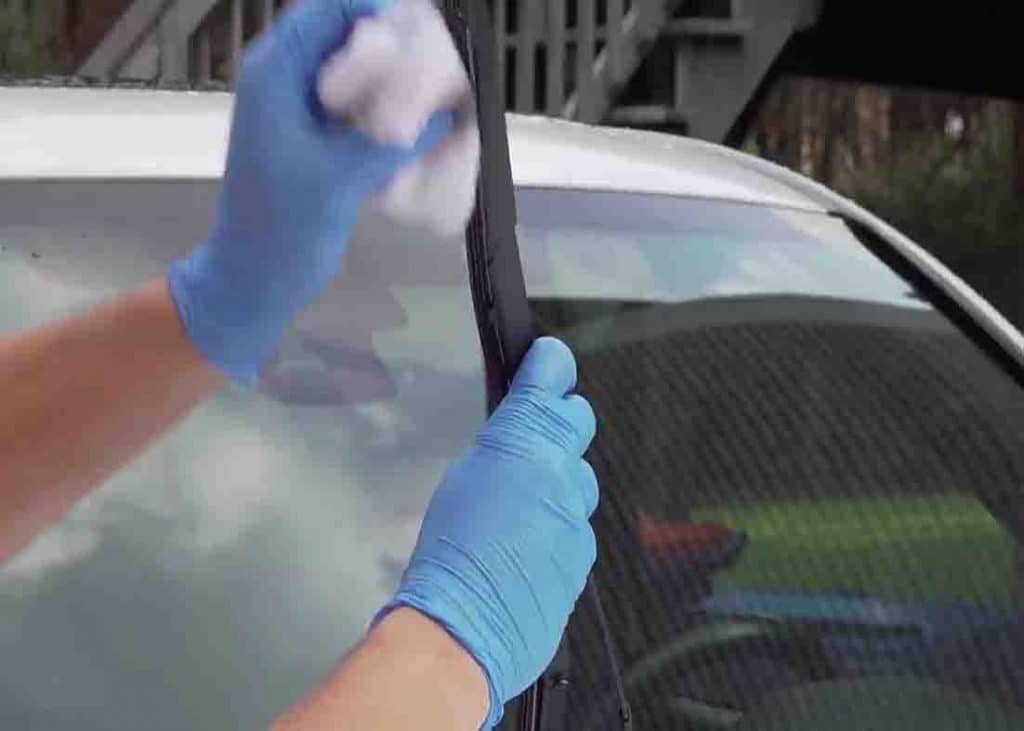 Wiping the wiper blades with rag soaked with WD-40
