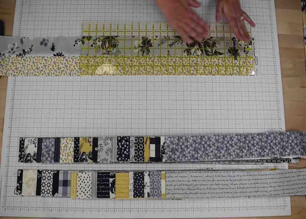 Cutting the jelly roll to make the 18 patch quilt