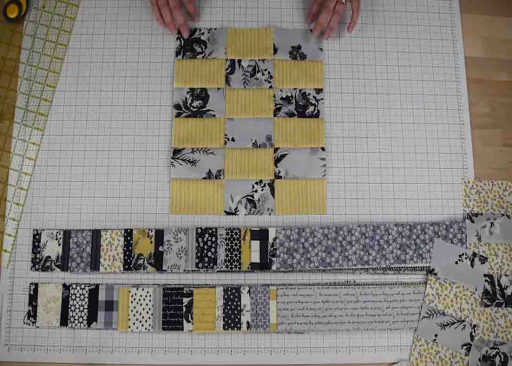 Sewing the strips together to create the 10 patch quilt block