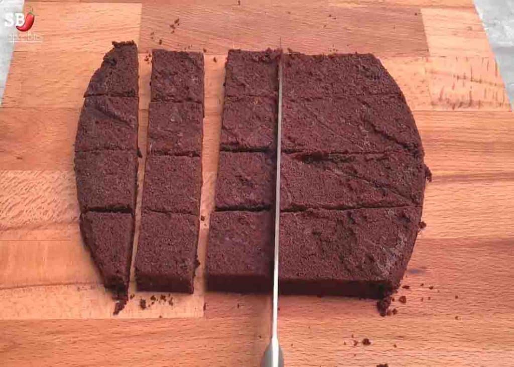 Cutting the brownie cake for the chocolate brownie box recipe