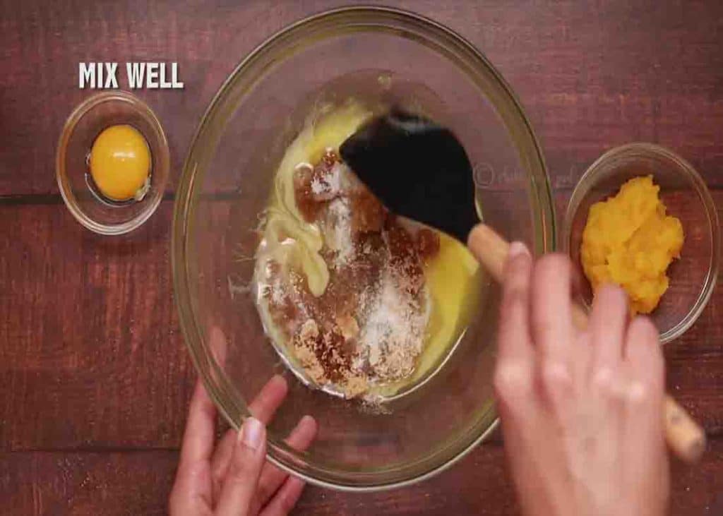 Mixing the wet ingredients of pumpkin snickerdoodle cookies recipe