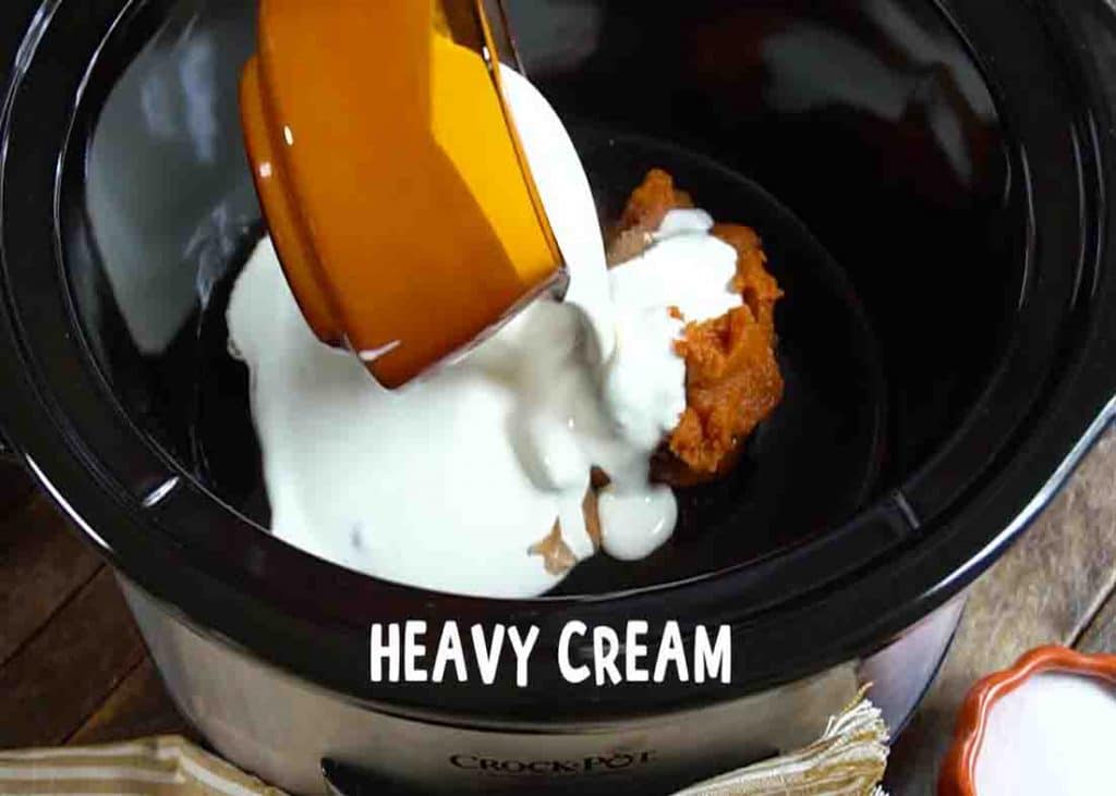 Adding all the pumpkin spice latte ingredients to the slow cooker