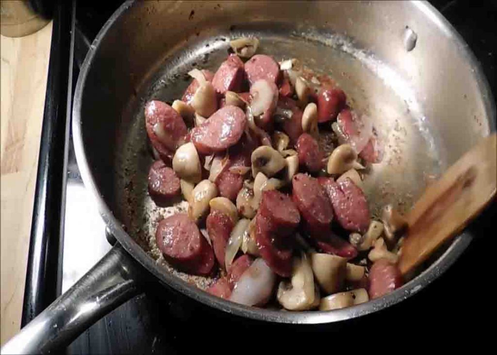 Frying the sausage and mushrooms for the southern potatoes and and sausage casserole