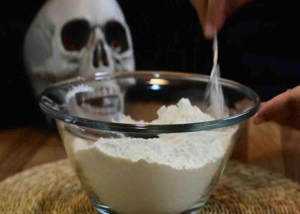 Mixing the dry ingredients for the witch finger-shaped cookies