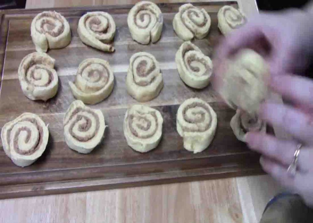 Separating the canned cinnamon rolls