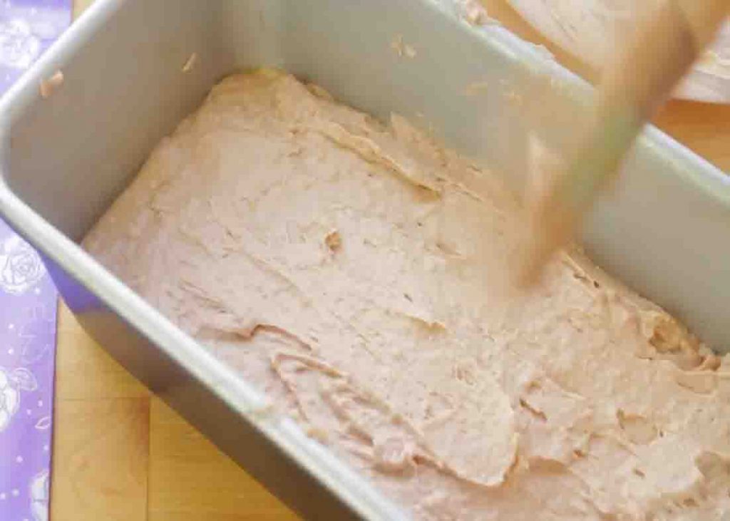 Transferring the bread dough to the loaf pan