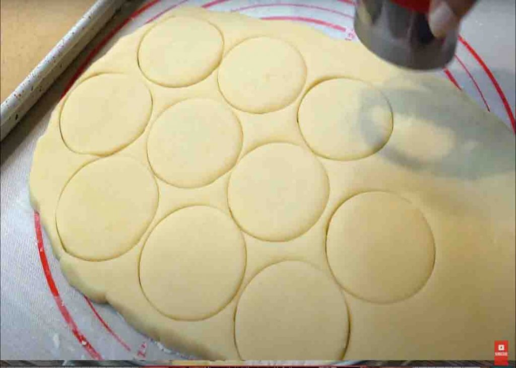 Cutting the dough into rounds to make the shortbread cookies