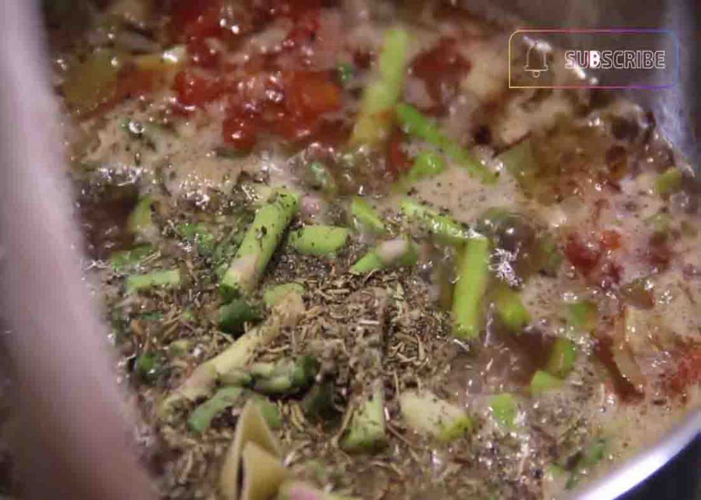 Seasoning the minestrone soup