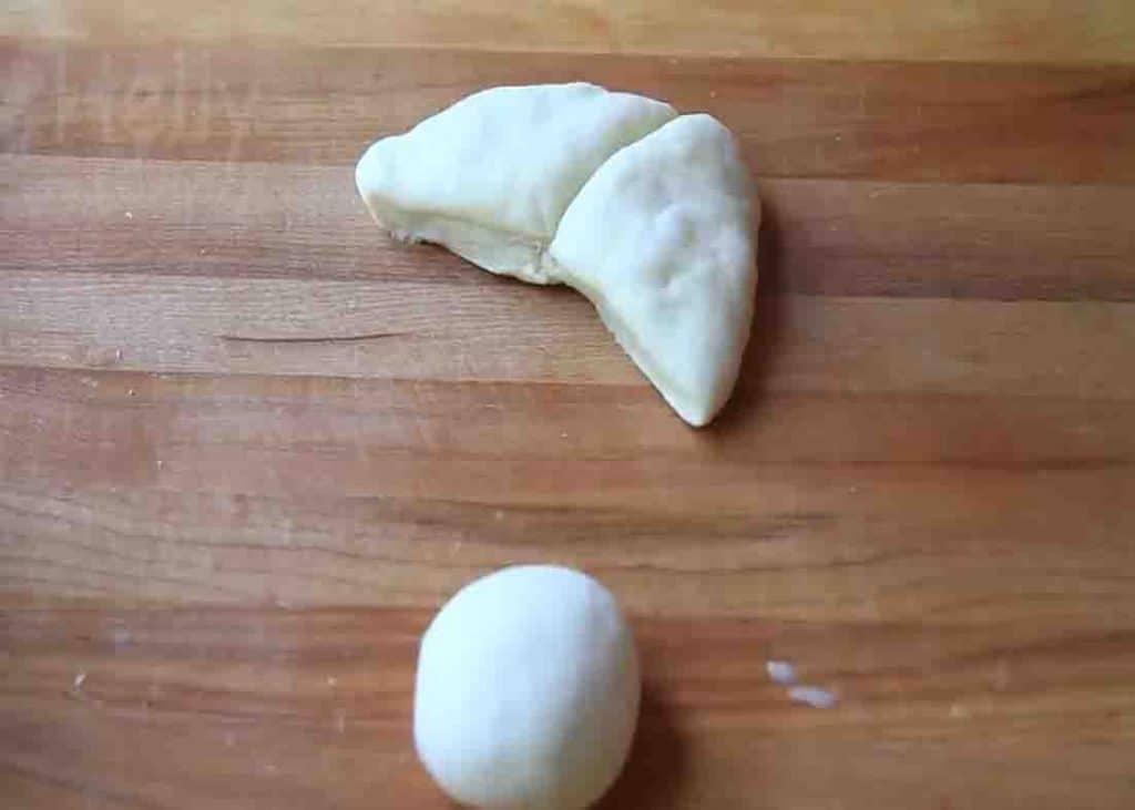 Dividing the dough to make the buttery bread