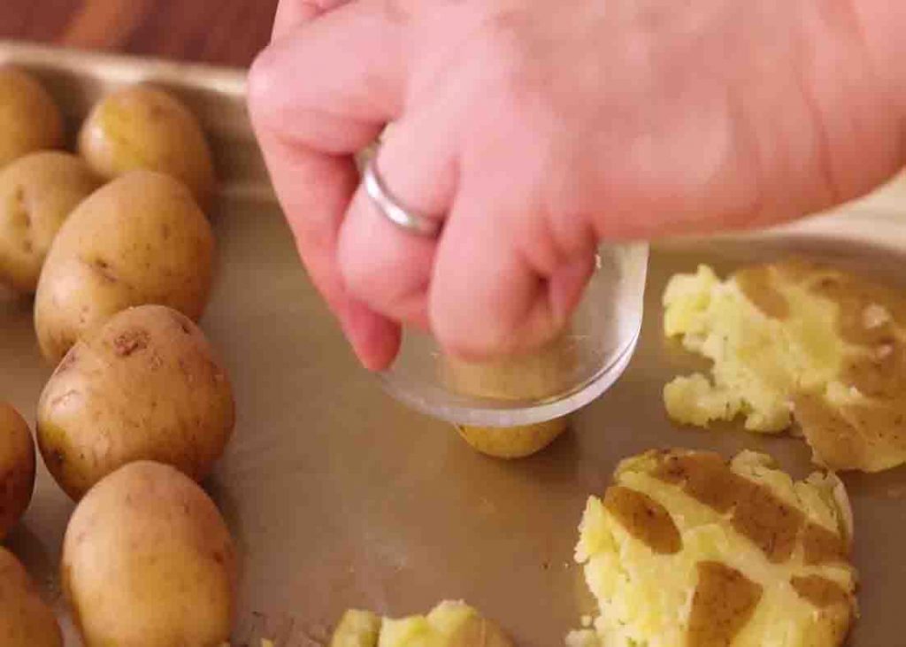 Smashing the potatoes before baking them