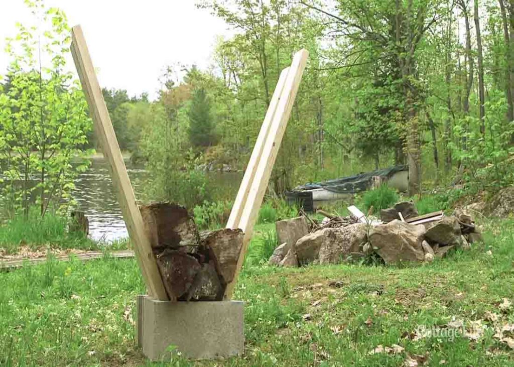 Filling the DIY firewood holder with the firewood