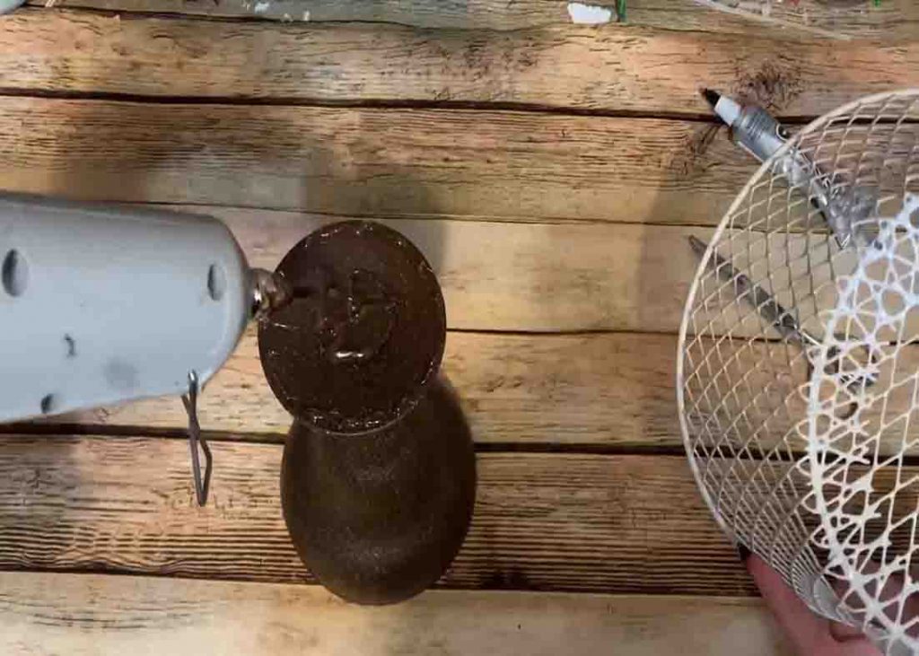 Attaching the basket to the glass to make the DIY k-cup holder