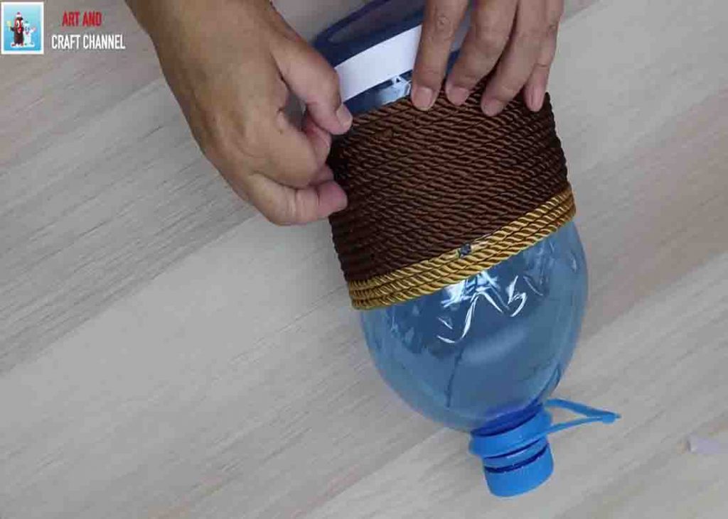 Wrapping the plastic bottle with rope