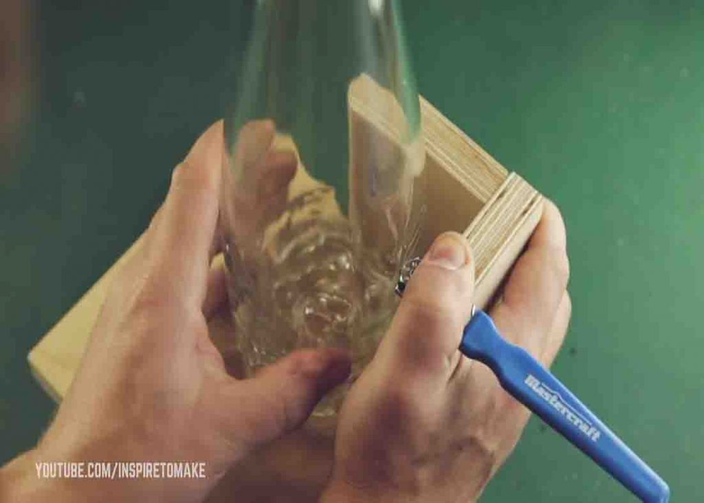 Cutting the wine bottle to make the DIY whiskey glass