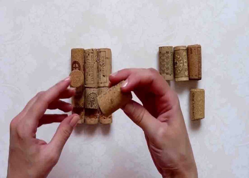 Gluing the corks together to make the DIY mobile holder