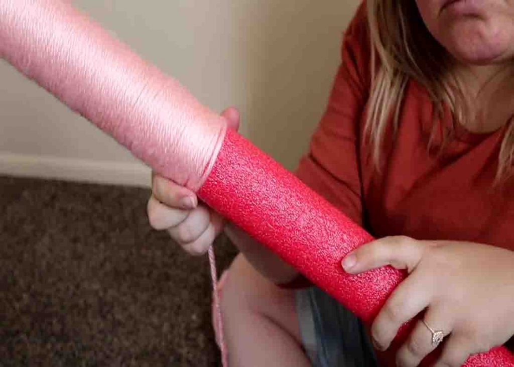 Wrap the pool noodle with your yarn