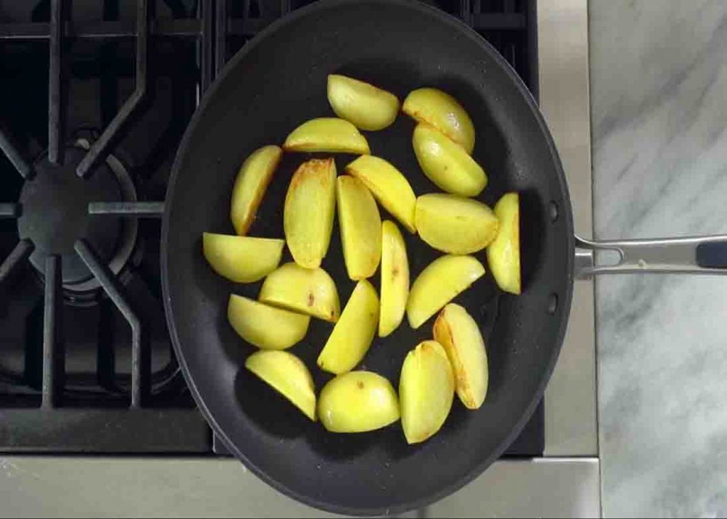 Browning the potatoes before braising