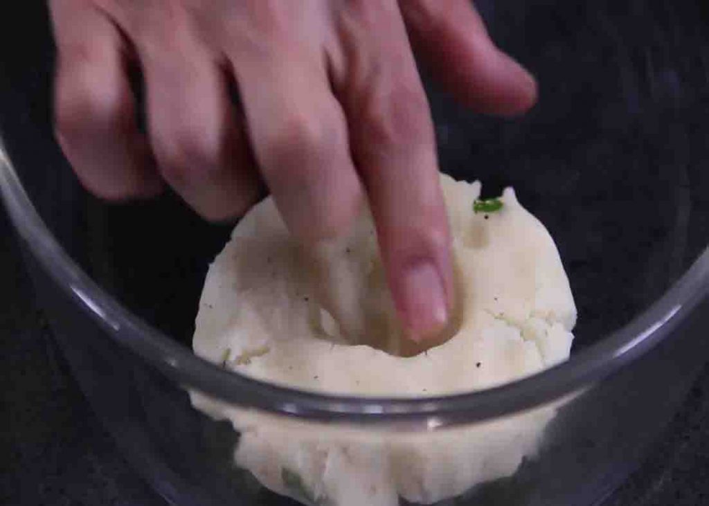 Shaping the mashed potato for the potato beef cake recipe