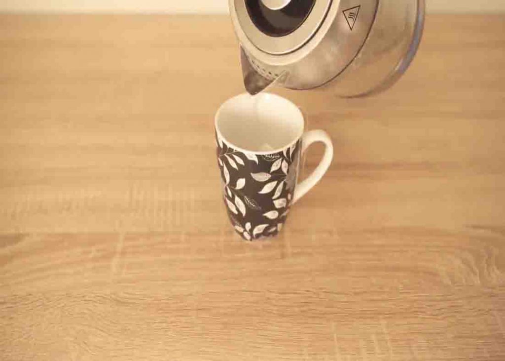 Steeping the tea bag in hot water