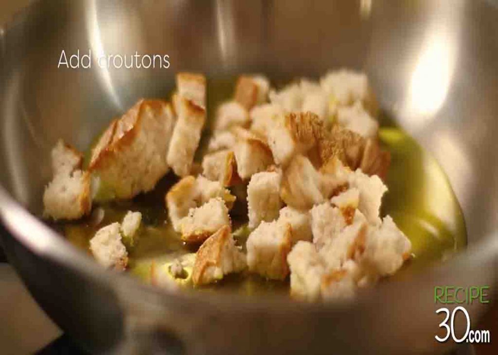 Frying the croutons for the Italian-style garlic soup recipe