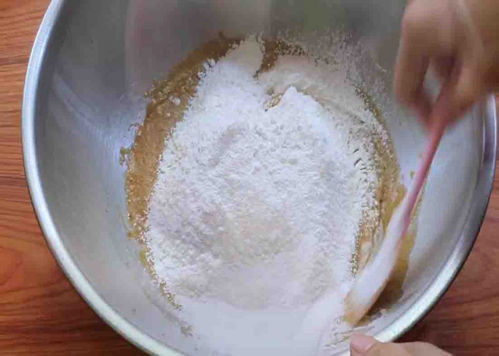 Mixing the flour and butter to make the cookie dough