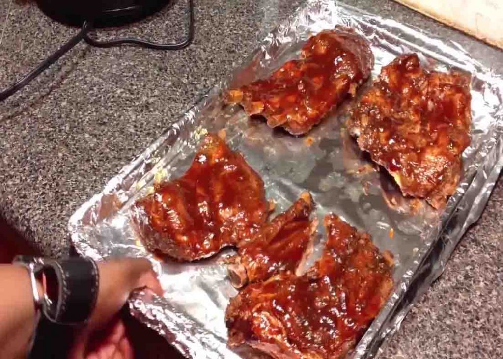 Smothering the ribs with bbq sauce