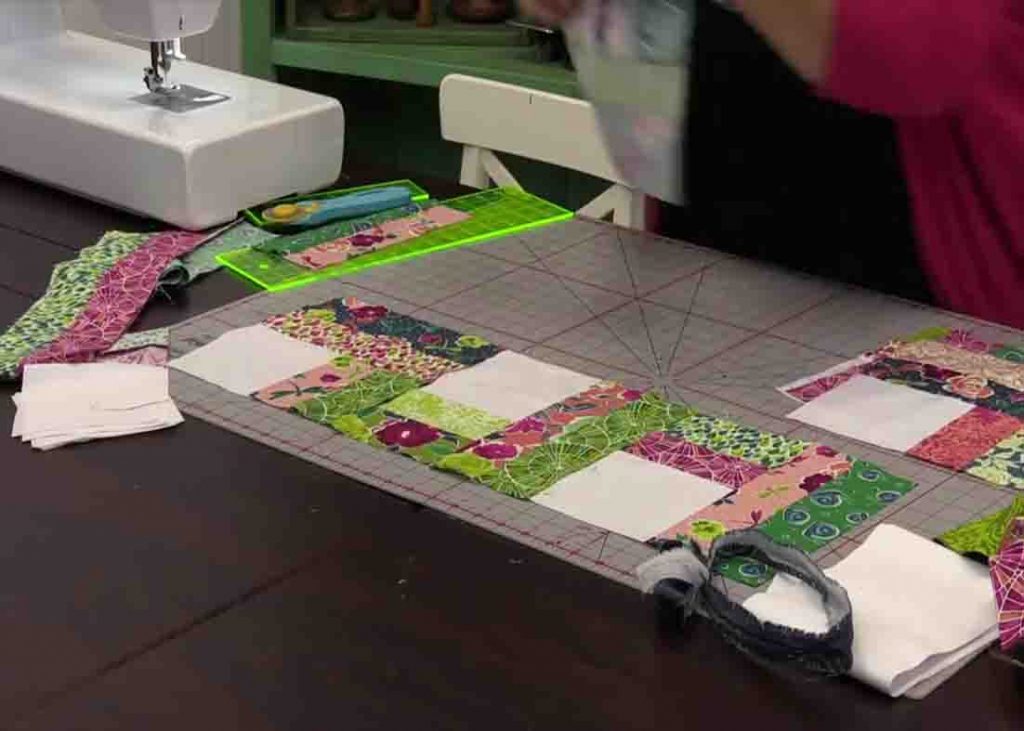 Laying the two-step quilt blocks together to make the quilt top