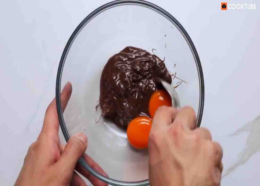 Combing the yolk and chocolate for the chocolate souffle recipe