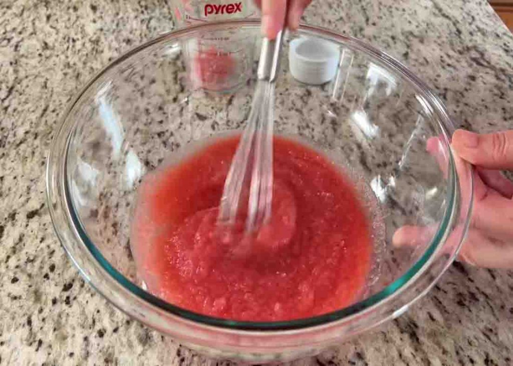 Mixing the ingredients together for the strawberry clouds dessert