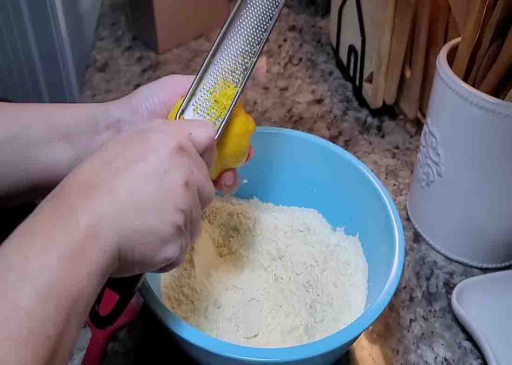 Zesting a lemon for the lemon loaf cake