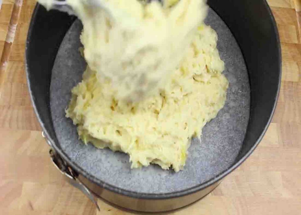 Pouring the pineapple cake batter to a springform pan