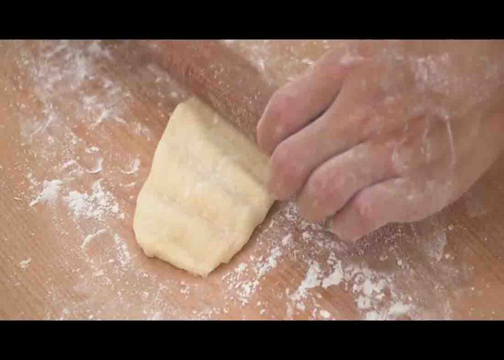 Rolling the soft bread dough out